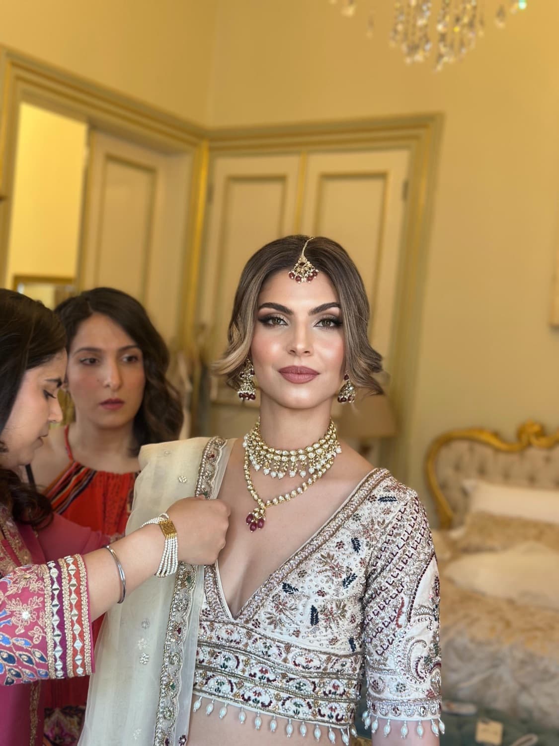 Bride getting ready with on-location bridal makeup and hair Los Angeles | LA Makeup Studio