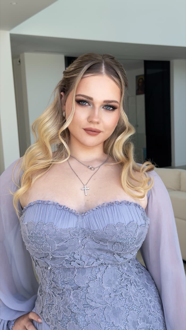 Client with soft glam event makeup and curled hair in Los Angeles | LA Makeup Studio